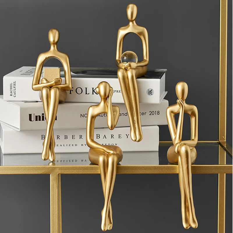 Gold thinker sculpture shelf decor